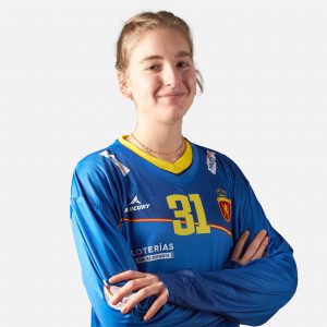 Portera de las Redsticks con la 1ª equipación oficial de niños de la RFEH color azul de manga larga